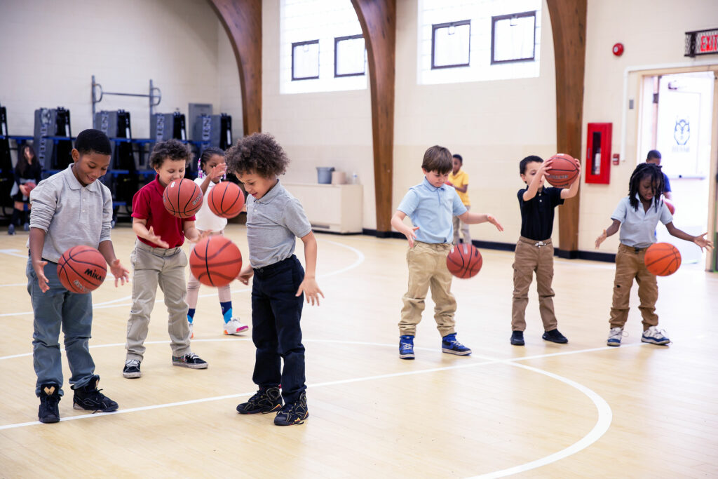 A group of elementary students playing basketball